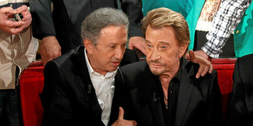 L'animateur Michel Drucker et le chanteur Johnny Hallyday le 14 mars 2014 sur le plateau de « Vivement dimanche ».
